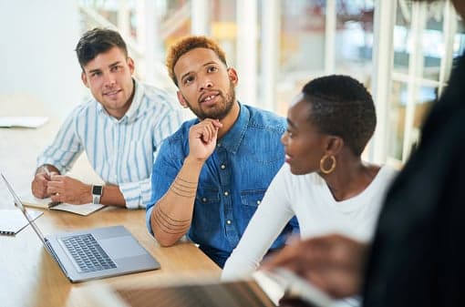 Shot of a group of young businesspeople having a meeting in a modern office